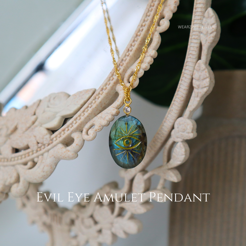 Evil Eye Amulet Pendant on a gold chain with a decorative frame.
